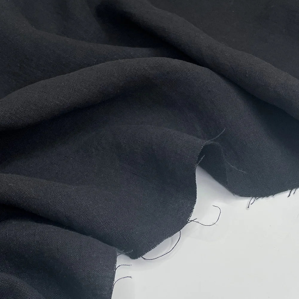 Black 100% hemp fabric on a table. 