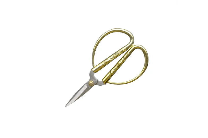 Pair of yellow-handled scissors on a white background for sewing and crafting from LDH scissors.