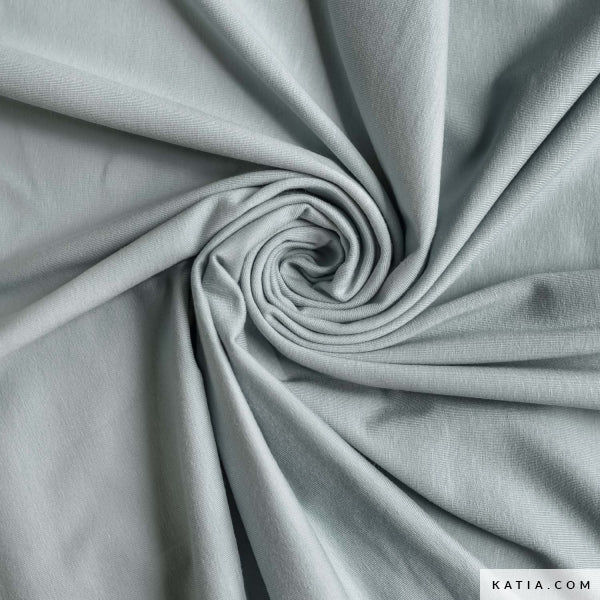 Swatch of blue jersey fabric for sewing apparel fabrics and garments.