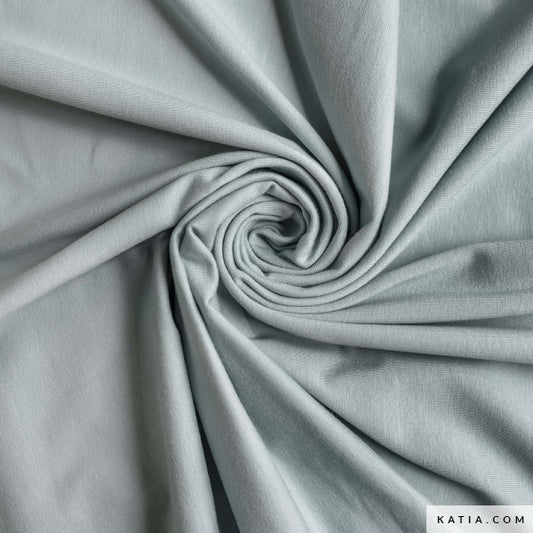 Swatch of blue jersey fabric for sewing apparel fabrics and garments.