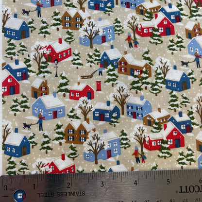 Fabric with winter snowy houses design from Liberty of London for sewing quilting and crafting. 