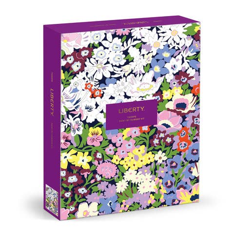 Colorful floral patterned box with 'Liberty' branding on a white background
