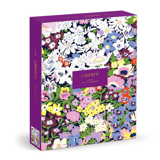 Colorful floral patterned box with 'Liberty' branding on a white background includes a paint by number set. 