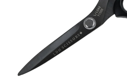 Close up of blades of black scissors with 'LDH Scissors' branding on a white background