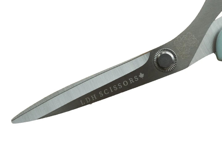 Pair of scissors with 'LDH Scissors' branding on a white background for sewing and crafting.