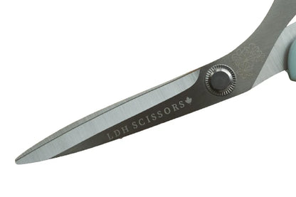Pair of scissors with 'LDH Scissors' branding on a white background for sewing and crafting.