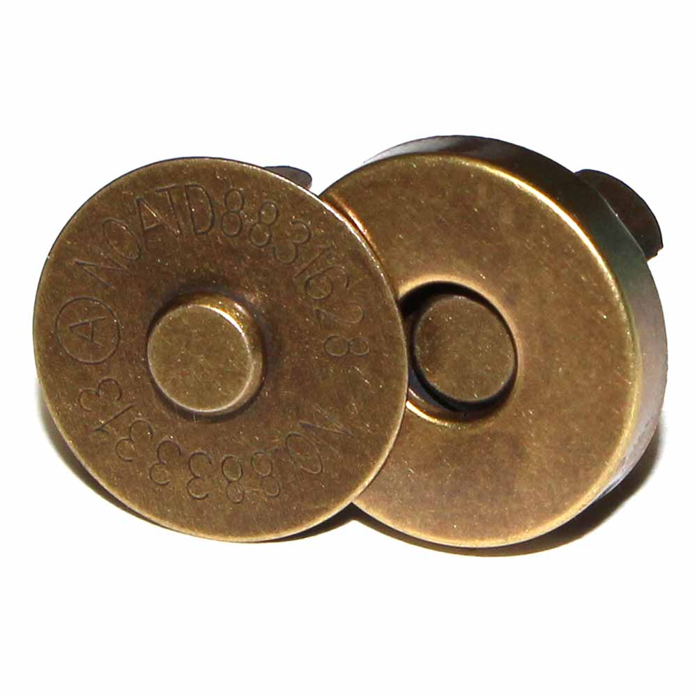 Two antique gold magnetic snaps for bagmaking and crafting.