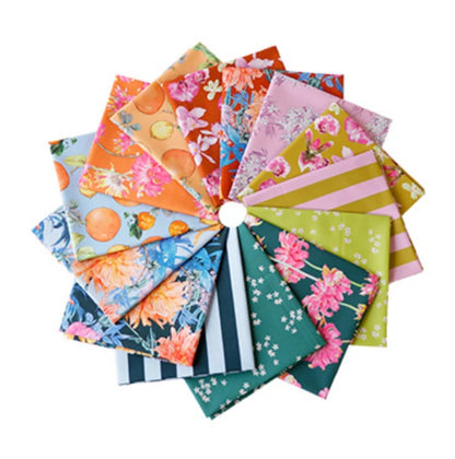 A fan arrangement of multiple colorful patterned fabric fat quarters on a plain white background. The fabrics feature floral, fruit, striped, and geometric prints in orange, pink, blue, green, yellow, and navy tones.