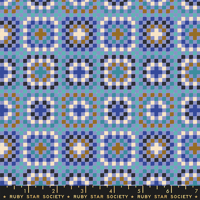 Patterned fabric with geometric design in blue, white, and brown on a blue background, featuring Ruby Star Society label.