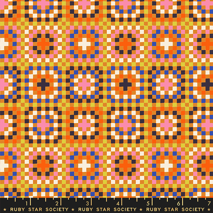 Colorful geometric pattern fabric with a ruler at the bottom, featuring the Ruby Star Society label.