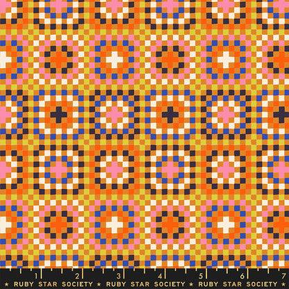 Colorful geometric pattern fabric with a ruler at the bottom, featuring the Ruby Star Society label.