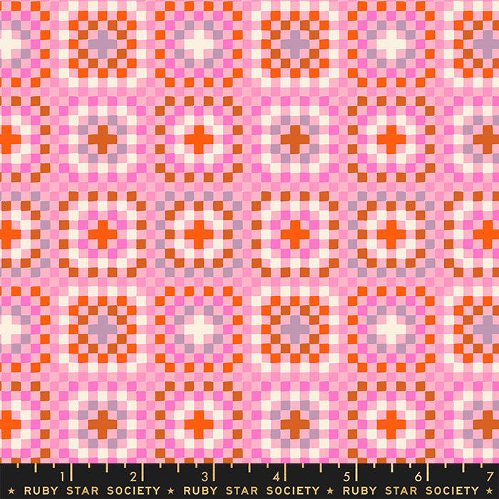 A close-up of a repeating geometric pattern in pink, orange, white, and light purple, with a black ruler strip along the bottom edge labeled Ruby Star Society.