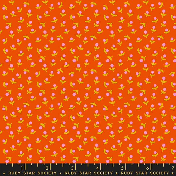 Fabric with small pink flowers on an orange background, labeled Ruby Star Society.