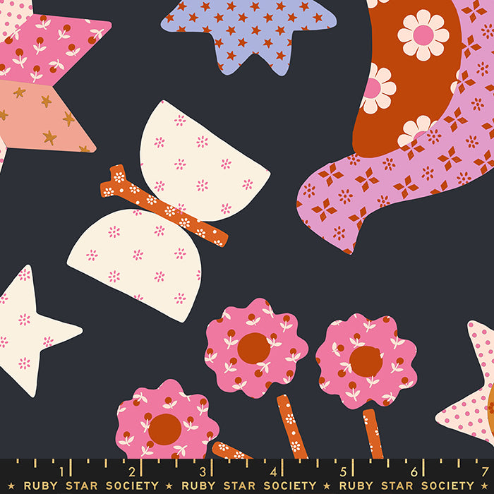 Colorful fabric pattern with stars, flowers, and butterflies on a dark background, featuring the Ruby Star Society label.