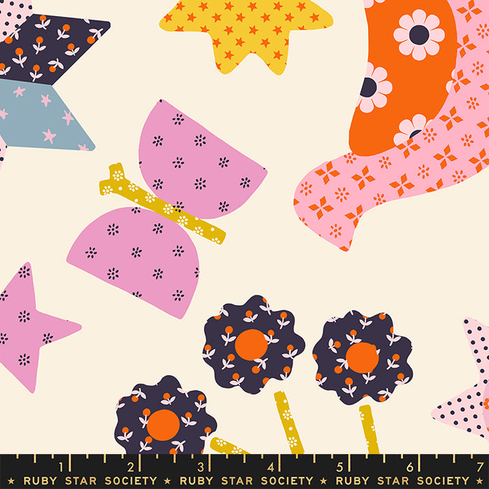 Colorful fabric pattern with flowers, stars, and butterflies on a beige background, featuring Ruby Star Society label.