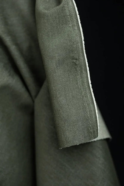 Close-up of green 100% organic cotton  denim fabric for sewing jeans and other garments from Merchant & Mills.