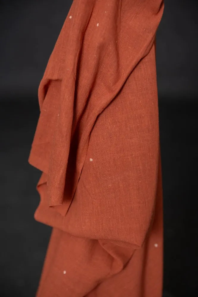 Organic hand woven cotton fabrics with small woven ditsy flowers from Merchant & Mills used for sewing garments.