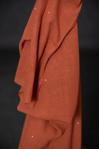 Organic hand woven cotton fabrics with small woven ditsy flowers from Merchant & Mills used for sewing garments.