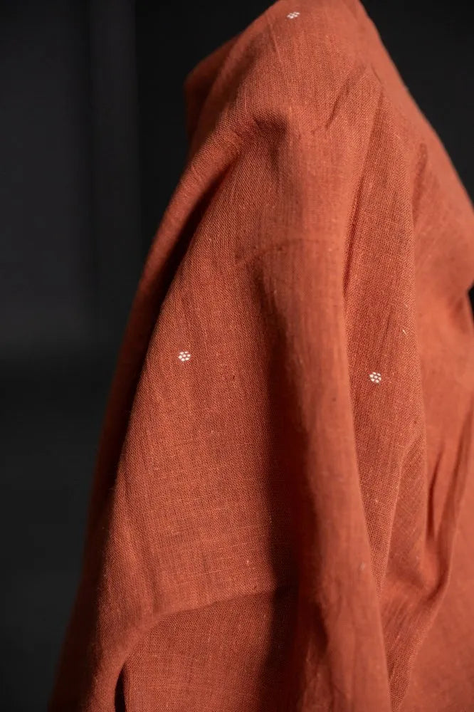 Organic hand woven cotton fabrics with small woven ditsy flowers from Merchant & Mills used for sewing garments.