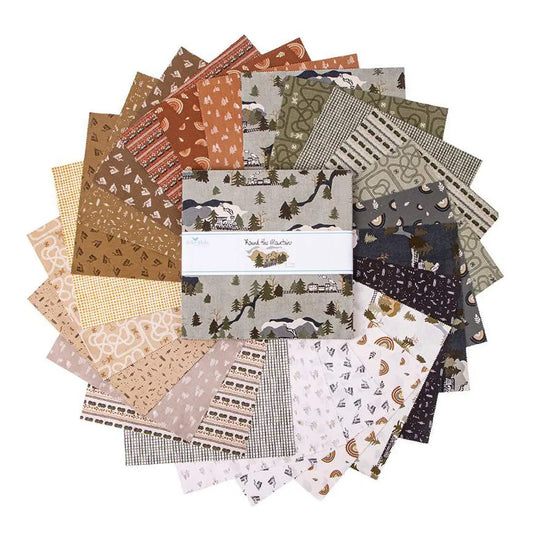 A collection of 10" square textiles with various patterns including floral, geometric, and animal motifs, primarily in a mountainous landscape theme. 42 piece layer cake named "round the mountain" by Casey Cometti from Riley Black Fabrics 10" squares.