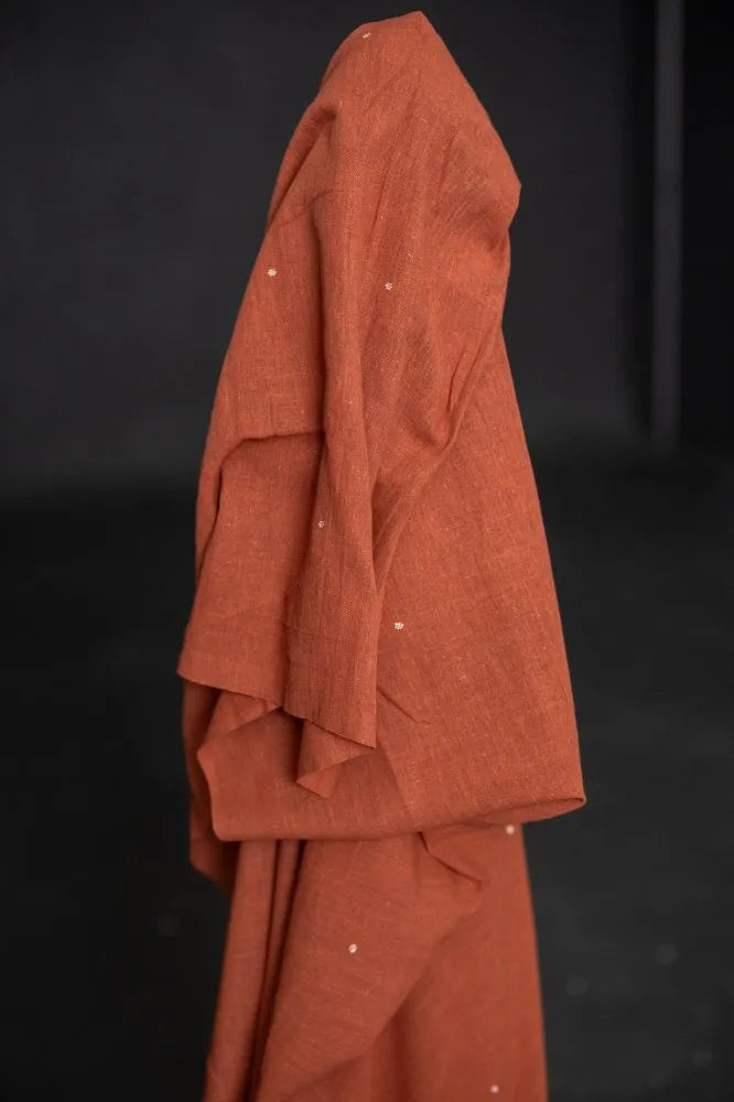 Organic hand woven cotton fabrics with small woven ditsy flowers from Merchant & Mills used for sewing garments.