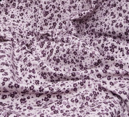 Close-up of purple floral patterned fabric
