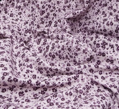 Close-up of purple floral patterned fabric