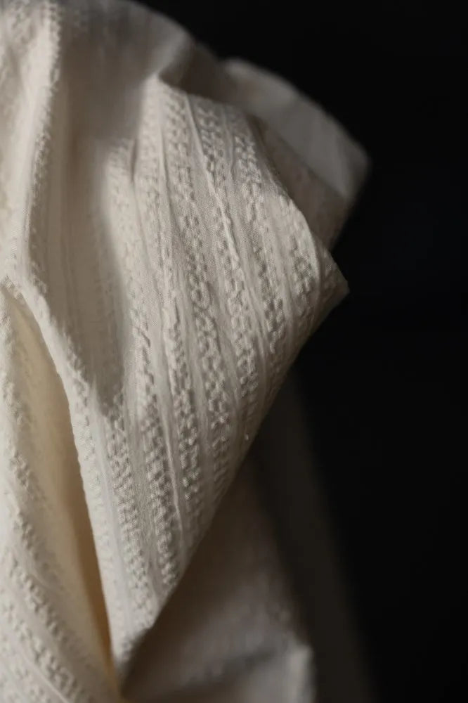 White seeksucker 100% organic cotton fabrics with stripe pattern. For sewing garments, from Merchant & Mills. 