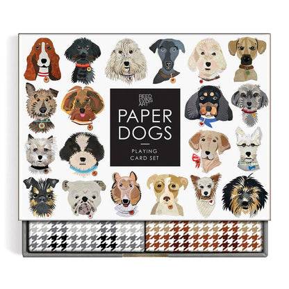 Paper Dogs Playing Card Set, featuring a white box decorated with colorful illustrations of various dog breeds around a central black square with white text. The bottom of the box reveals two rows of houndstooth patterned cards in black/white, gray/white, and brown/white.