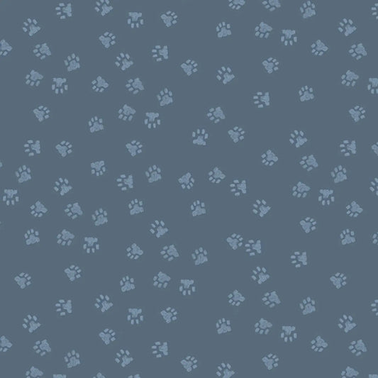 A fabric with a pattern of paw prints on a grey background, intended for quilting and crafting.