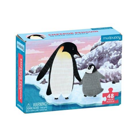 A 48-piece jigsaw puzzle box titled 'Emperor Penguin' by the brand mudpuppy. The box features an illustration of an emperor penguin and its chick standing on a snowy mountain landscape under a pink and blue sky.