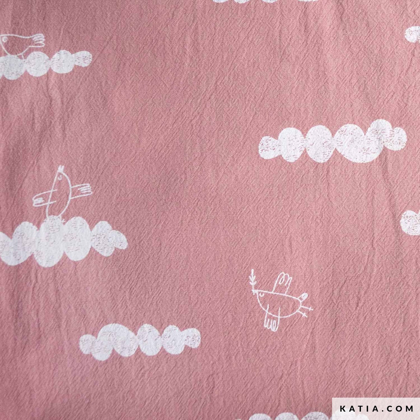 Pink fabric with white cloud and bird patterns, branded 'KATIA'.