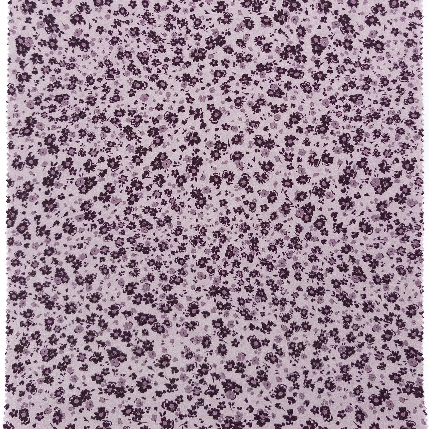 Floral pattern with small purple flowers on a light purple background