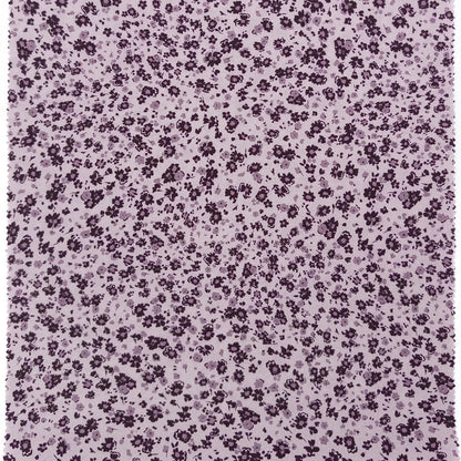 Floral pattern with small purple flowers on a light purple background