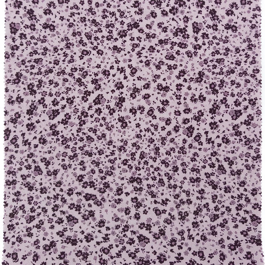 Floral pattern with small purple flowers on a light purple background