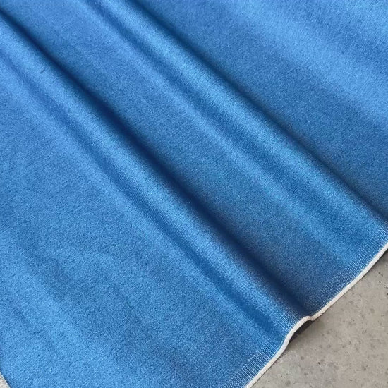 Close up of a blue denim fabric to show movement. 