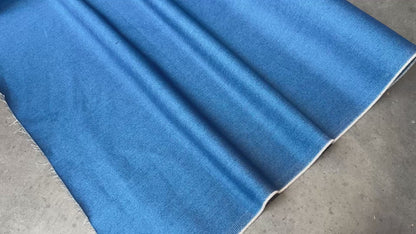 Close up of a blue denim fabric to show movement. 