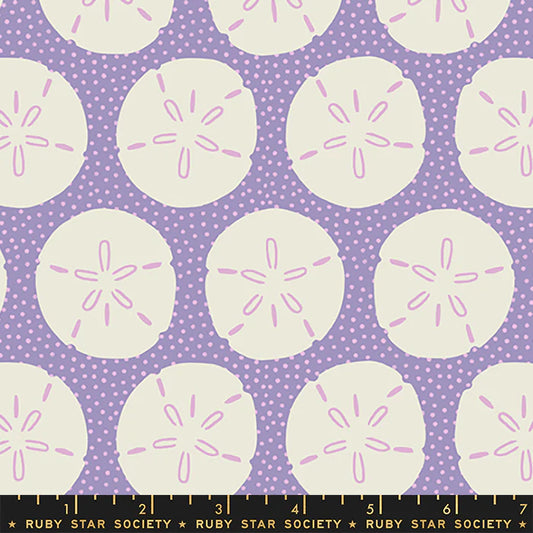 Pattern of light sand dollar circles with pink centers on a purple background with white polka dots, Ruby Star Society label at the bottom.
