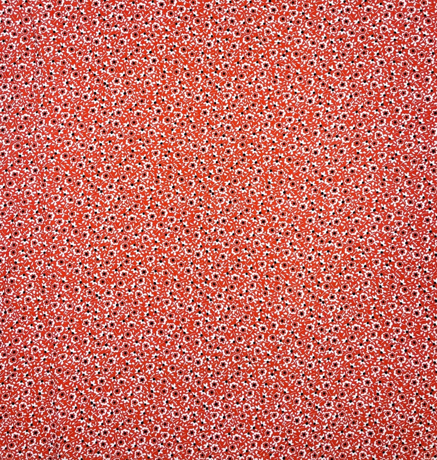 Red floral patterned fabric texture