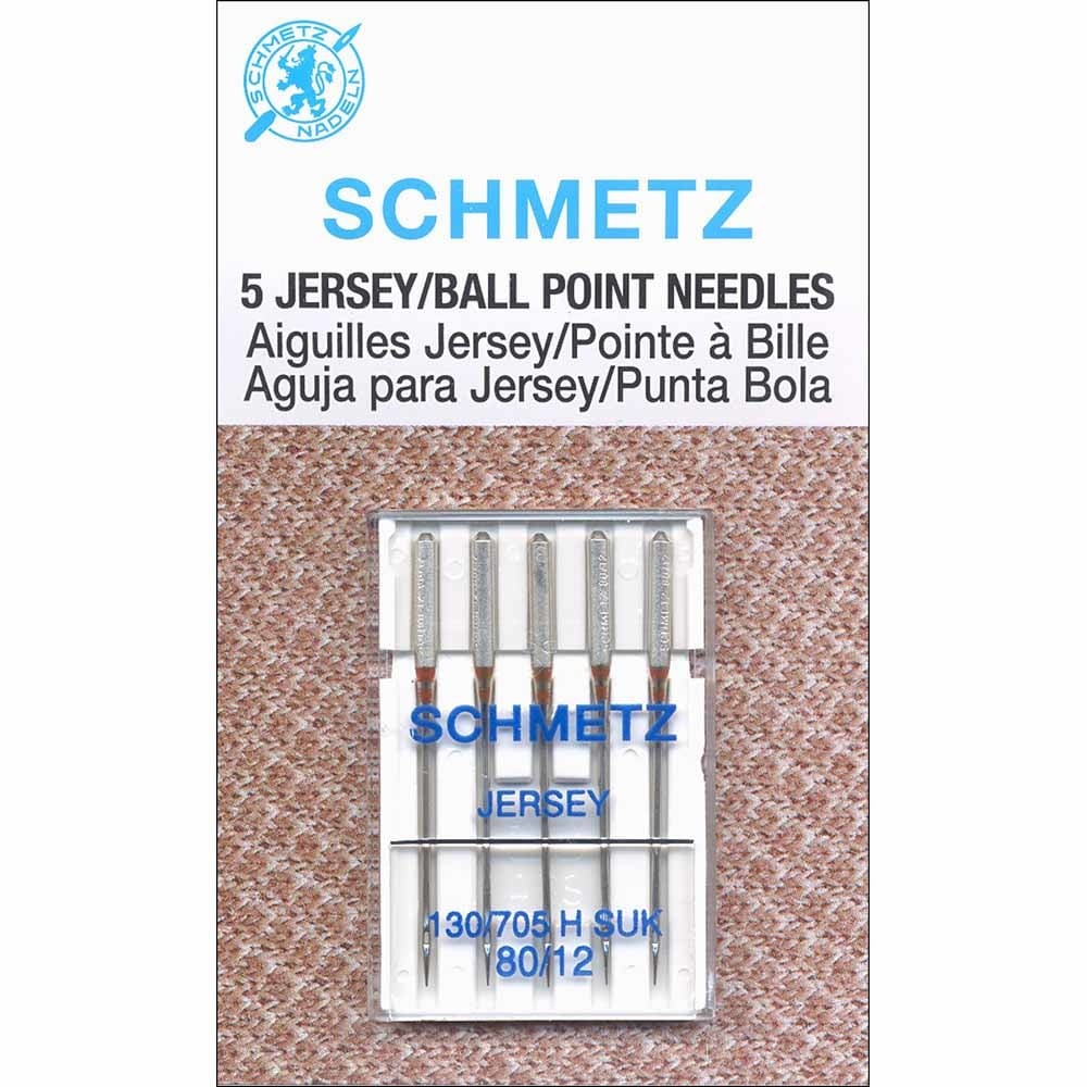 Schmetz jersey ball point sewing machine needles packaging on a textured brown background