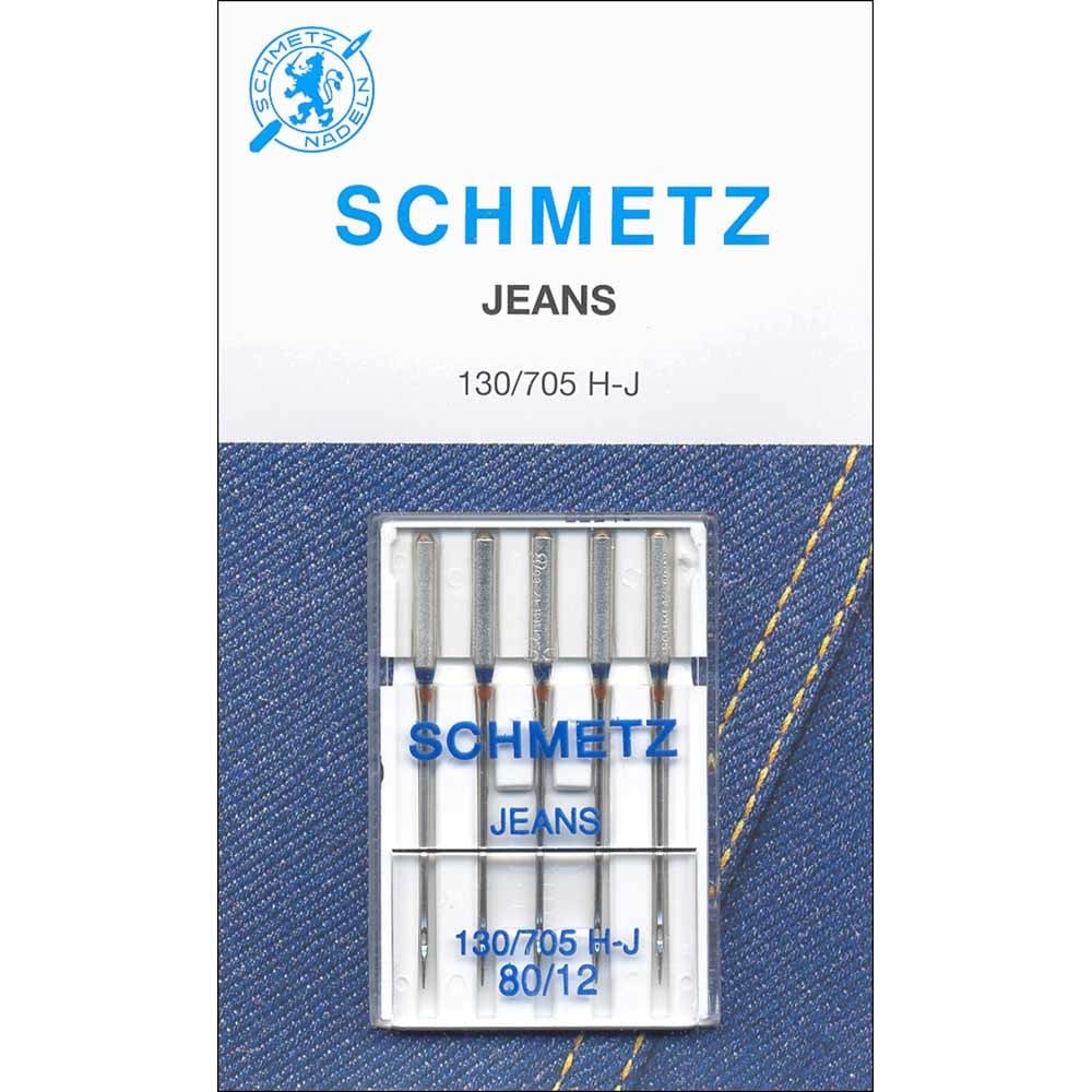Pack of Schmetz jeans sewing machine needles on a denim background with Schmetz logo.