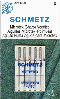 Schmetz Microtex sharp sewing machine needle packet with needles on a green background