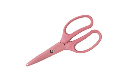 Pink craft scissors with cover on a white background