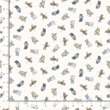 Patterned fabric with cartoon characters on a white background, measured against a ruler.