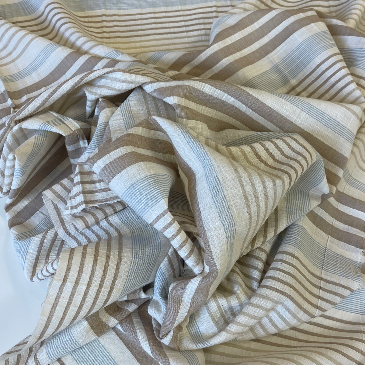 Striped fabric with brown and beige pattern on a white background