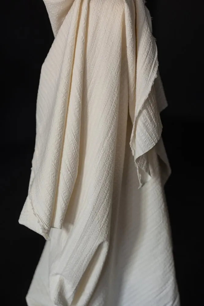 White seeksucker 100% organic cotton fabrics with stripe pattern. For sewing garments, from Merchant & Mills. 