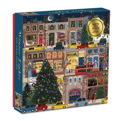 A 500-piece jigsaw puzzle box titled 'Winter Night' by the brand 'puzzle'. The box features a colorful, detailed illustration of a snowy city street at night with Christmas trees, colorful cars, and lit-up storefronts.