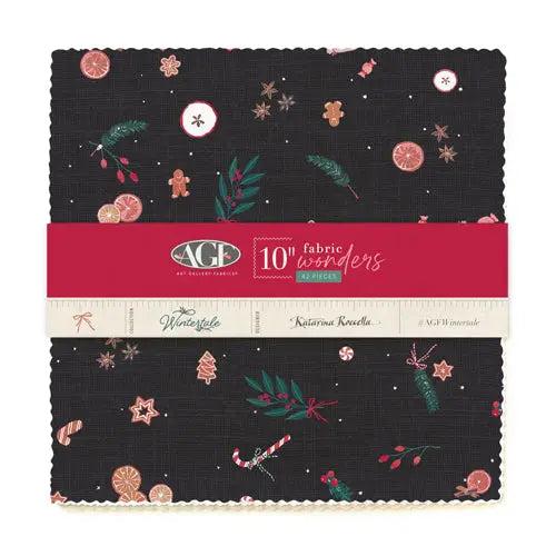 A bundle of art gallery fabric squares featuring a winter holiday theme with designs including Christmas trees and ornaments on a dark background.