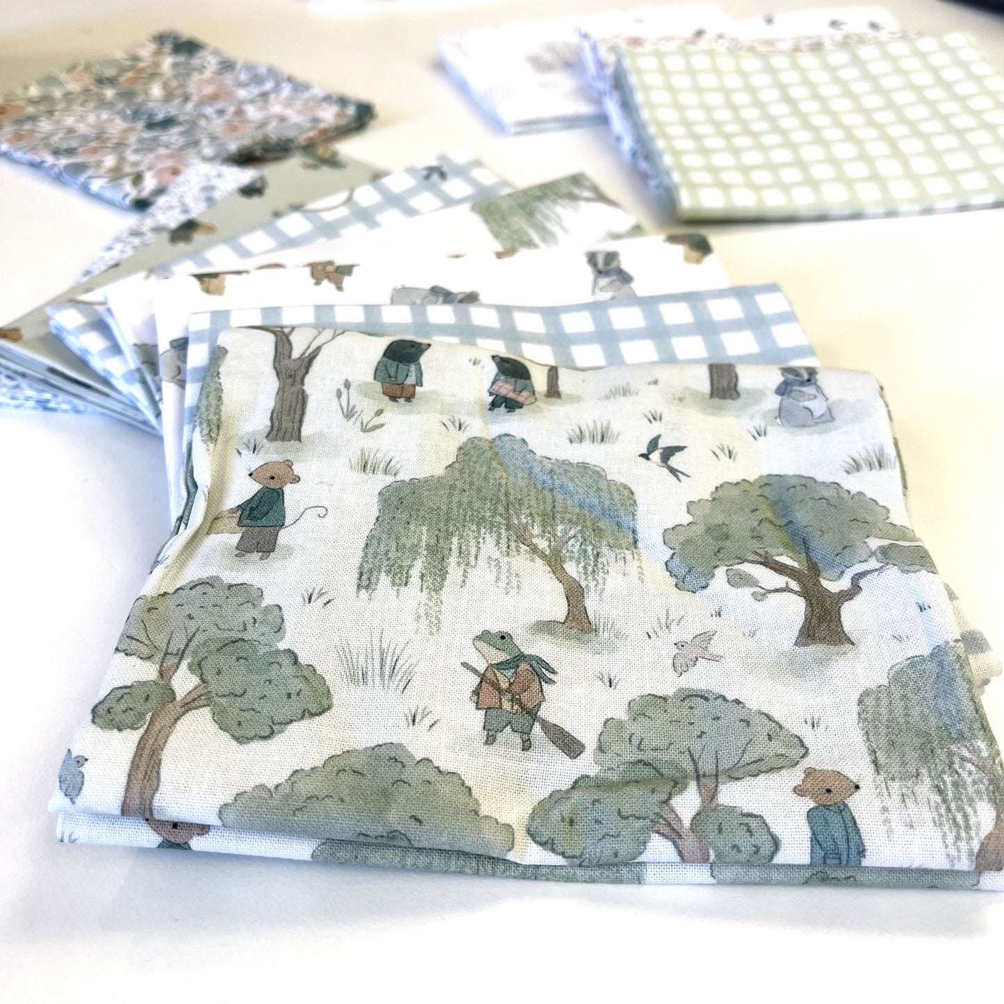 Fabric with bear and tree pattern on a white surface