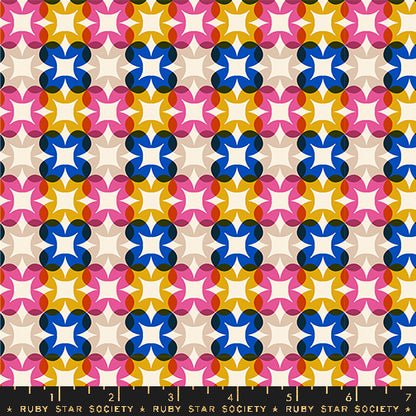 Patterned fabric with colorful geometric design on a beige background, featuring the Ruby Star Society label.
